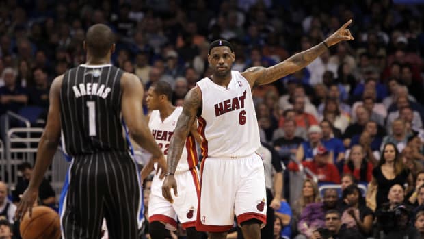February 3, 2011; Orlando, FL, USA; Miami Heat small forward LeBron James (6) defends as Orlando Magic point guard Gilbert Arenas