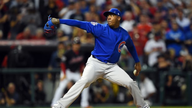 Nov 2, 2016; Cleveland, OH, USA; Chicago Cubs relief pitcher Aroldis Chapman throws a pitch against the Cleveland Indians in the 8th inning in game seven of the 2016 World Series at Progressive Field.
