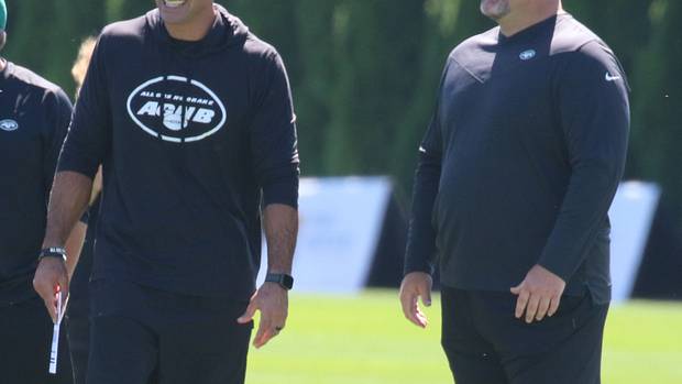 Robert Saleh and Joe Douglas on the practice field