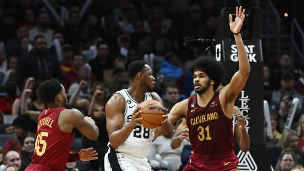 Cleveland Cavaliers center Jarrett Allen (31) and guard Donovan Mitchell (45) defend against San Antonio Spurs center Charles Bassey (28) during the second half at Rocket Mortgage FieldHouse.