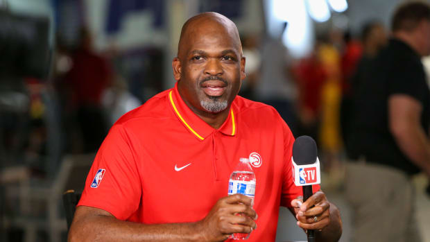 Nate McMillan smiles during an interview.