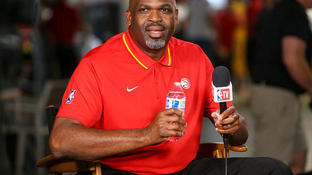 Nate McMillan smiles during an interview.