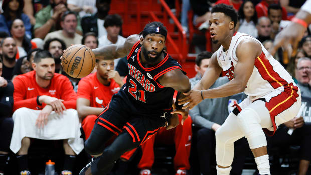 Apr 14, 2023; Miami, Florida, USA; Chicago Bulls guard Patrick Beverley (21) drives to the basket against Miami Heat guard Kyle Lowry (7) during the fourth quarter at Kaseya Center.
