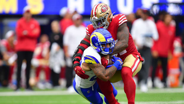 Sep 17, 2023; Inglewood, California, USA; Los Angeles Rams running back Kyren Williams (23) is brought down by San Francisco 49ers linebacker Dre Greenlaw (57) during the first half at SoFi Stadium. Mandatory Credit: Gary A. Vasquez-USA TODAY Sports
