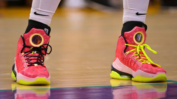 View of Brittney Griner's pink and yellow Nike shoes.