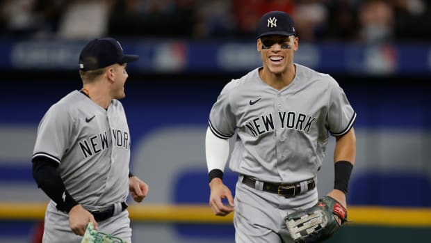 Oct 4, 2022; Arlington, Texas, USA; New York Yankees center fielder Harrison Bader (22) and right fielder Aaron Judge (99) jog off the field after the first inning against the Texas Rangers at Globe Life Field. Mandatory Credit: Tim Heitman-USA TODAY Sports