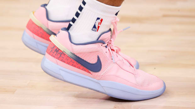 View of pink and blue Nike Ja shoes.