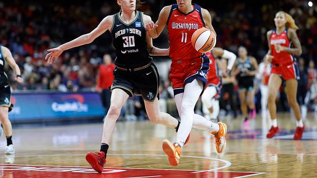 Washington Mystics forward Elena Delle Donne dribbles past New York Liberty forward Breanna Stewart.