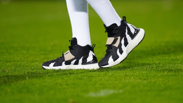 View of Deion Sanders' black and white Nike sneakers before a Colorado Buffaloes football game.