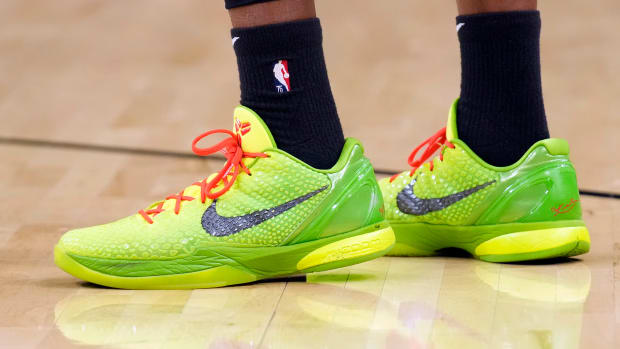 View of green Nike Kobe shoes.