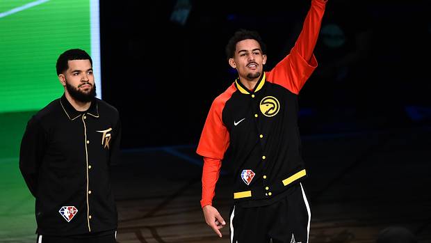 Trae Young points to the sky before the three-point contest.