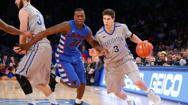 Mar 13, 2014; New York, NY, USA; Creighton Bluejays forward Doug McDermott (3) drives to the basket against DePaul Blue Demons guard Charles McKinney (32) in the second round of the Big East college basketball tournament at Madison Square Garden