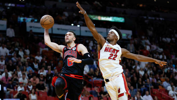 Apr 14, 2023; Miami, Florida, USA; Chicago Bulls guard Zach LaVine (8) drives to the basket ahead of Miami Heat forward Jimmy Butler (22) during the third quarter at Kaseya Center.