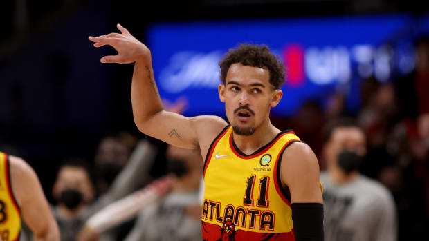 Atlanta Hawks guard Trae Young holds his follow-through after made shot.
