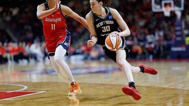 New York Liberty forward Breanna Stewart dribbles past Washington Mystics forward Elena Delle Donne.