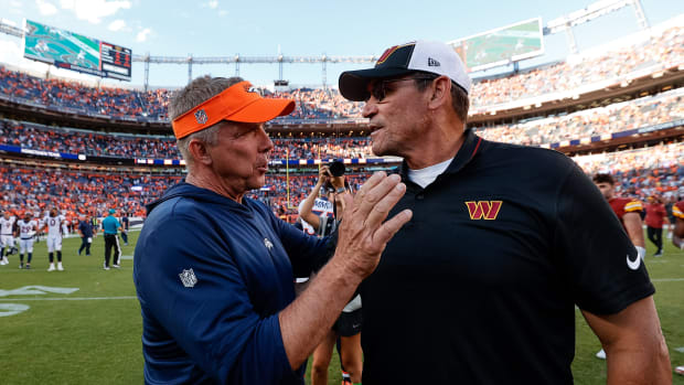 Denver Broncos head coach Sean Payton greets Washington Commanders head coach Ron Rivera after the game at Empower Field at Mile High.