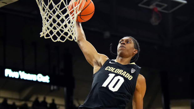 Boulder, Colorado, USA; Colorado Buffaloes forward Cody Williams (10) finishes off a basket in the second half against the USC Trojans at the CU Events Center.