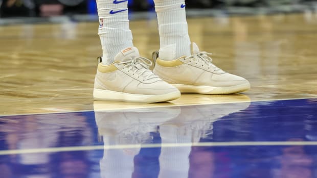 Devin Booker's tan and white Nike sneakers.
