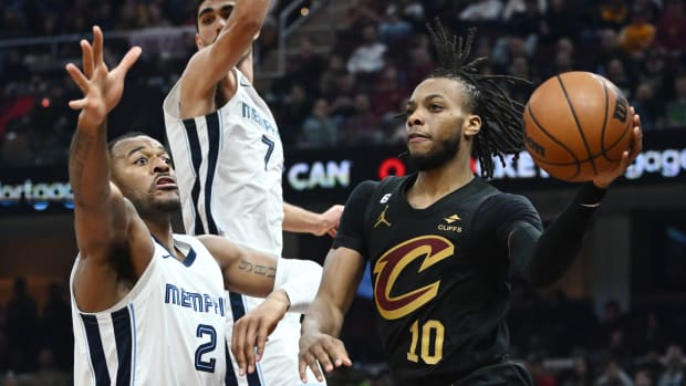 Cleveland Cavaliers guard Darius Garland (10) passes as Memphis Grizzlies forward Xavier Tillman (2) defends during the first half at Rocket Mortgage FieldHouse.