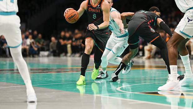 Washington Wizards forward Deni Avdija (8) looks to pass during the artist half against the Charlotte Hornets at Capital One Arena.
