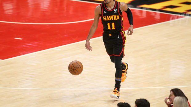 Apr 24, 2022; Atlanta, Georgia, USA; Atlanta Hawks guard Trae Young (11) dribbles against the Miami Heat in the first quarter during game four of the first round for the 2022 NBA playoffs at State Farm Arena.
