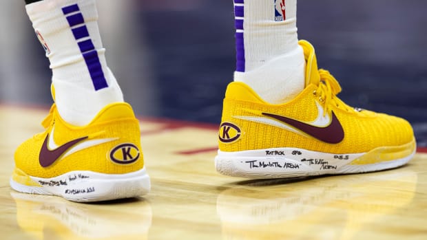 Los Angeles Lakers forward LeBron James' gold and maroon Nike sneakers.