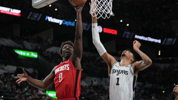 Rockets forward Jae'Sean Tate shoots in front of San Antonio Spurs center Victor Wembanyama (1) in the second half at the Frost Bank Center.