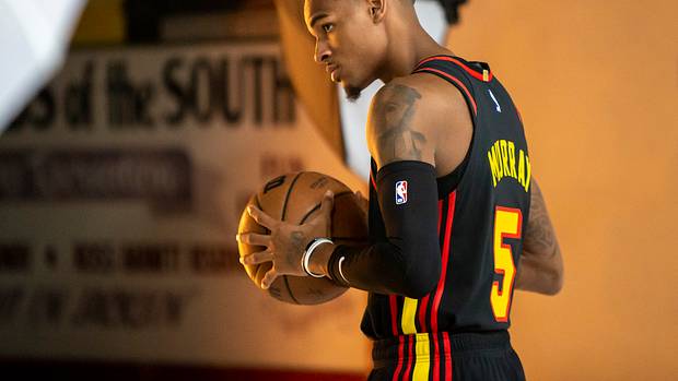 Dejounte Murray poses for a photo.