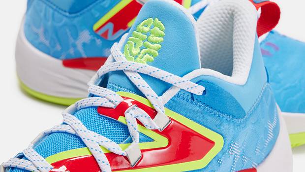 Detailed look at blue, green, and red New Balance shoes.