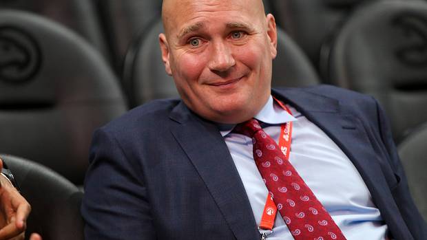 Travis Schlenk watches a game from the stands.