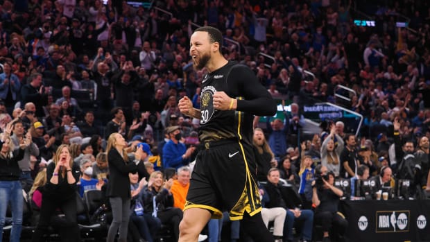 Golden State Warriors guard Stephen Curry celebrates after a play.