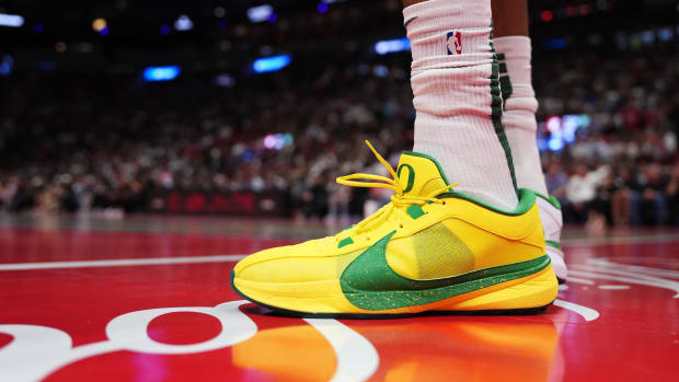 Milwaukee Bucks forward Giannis Antetokounmpo's yellow and green Nike sneakers.