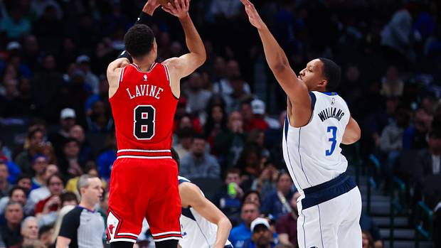 Chicago Bulls star Zach LaVine shoots over Dallas Mavericks' Grant Williams.