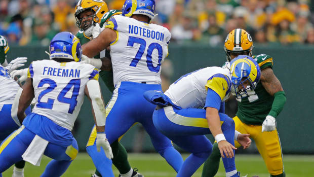 Los Angeles Rams quarterback Brett Rypien (11) tries to recover his fumble against the Green Bay Packers during their football game Sunday, November 5, 2023, at Lambeau Field in Green Bay, Wis.