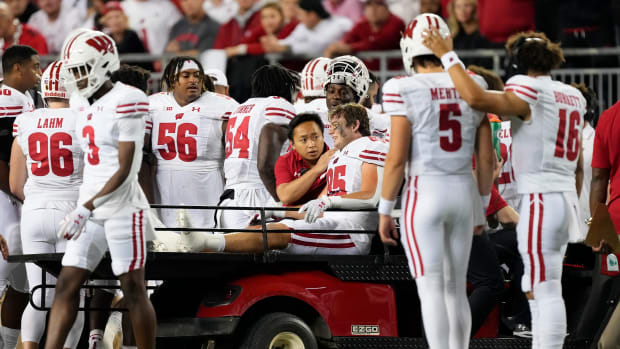 Wisconsin tight end Clay Cundiff being carted off the field against Ohio State.
