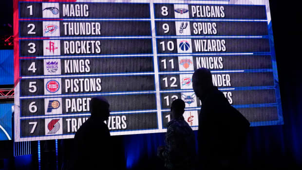 May 17, 2022; Chicago, IL, USA; People look at the draft lottery order after the 2022 NBA Draft Lottery at McCormick Place.