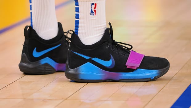 Los Angeles Clippers forward Paul George's black and blue Nike sneakers.