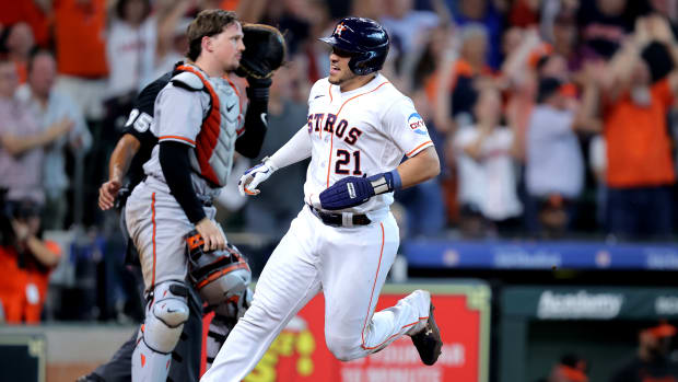 Sep 20, 2023; Houston, Texas, USA; Houston Astros catcher Yainer Diaz (21) crosses home plate to score the winning run against the Baltimore Orioles during the ninth inning at Minute Maid Park. Mandatory Credit: Erik Williams-USA TODAY Sports  