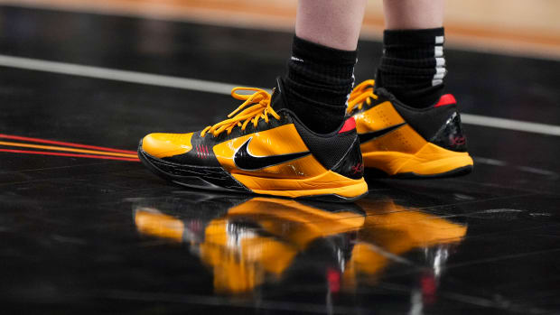 View of Caitlin Clark's black and gold Nike Kobe shoes.