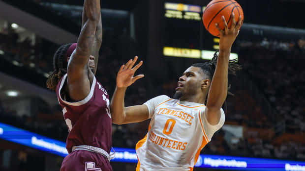 Feb 24, 2024; Knoxville, Tennessee, USA; Tennessee Volunteers forward Jonas Aidoo (0) goes to the basket against Texas A&M Aggies guard Manny Obaseki (35) during the second half at Thompson-Boling Arena at Food City Center.