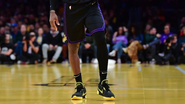 View of Los Angeles Lakers forward LeBron James's black and yellow Nike sneakers.