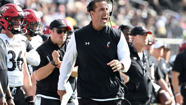 Luke Fickell yells out a play call from the Cincinnati sideline.