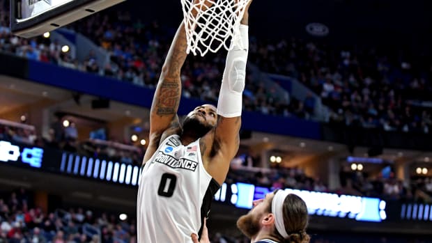 Mar 19, 2022; Buffalo, NY, USA; Providence Friars center Nate Watson (0) dunks the ball against Richmond Spiders forward Grant Golden (33) during the second round of the 2022 NCAA Tournament at KeyBank Center. Mandatory Credit: Mark Konezny-USA TODAY Sports