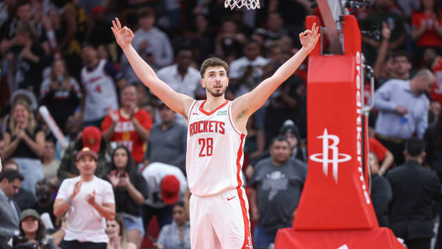 Rockets center Alperen Sengun (28) celebrates after scoring a basket during the fourth quarter against the San Antonio Spurs at Toyota Center.