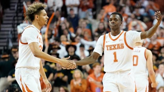 Feb 5, 2022; Austin, Texas, USA; Texas Longhorns guard Andrew Jones (1) congratulated by forward Tre Mitchell (33) after scoring a three point basket during the second half against the Iowa State Cyclones at Frank C. Erwin Jr. Center. Mandatory Credit: Scott Wachter-USA TODAY Sports