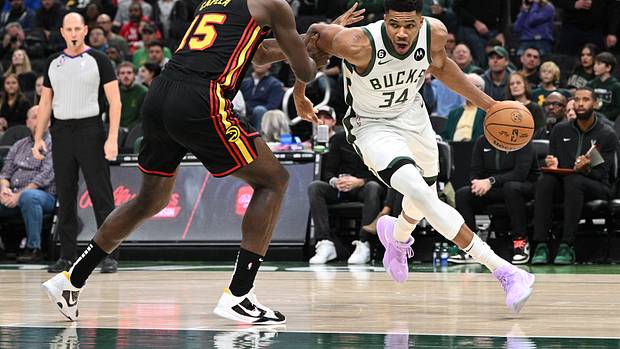 Bucks forward Giannis Antetokounmpo dribbles past Hawks center Clint Capela.