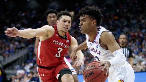 Mar 12, 2022; Kansas City, MO, USA; Kansas Jayhawks guard Remy Martin (11) drives to the basket during the second half against the Texas Tech Red Raiders at T-Mobile Center. Mandatory Credit: William Purnell-USA TODAY Sports