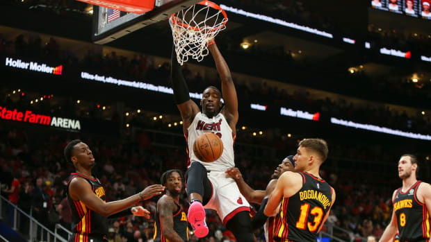 Apr 24, 2022; Atlanta, Georgia, USA; Miami Heat center Bam Adebayo (13) dunks against the Atlanta Hawks in the second quarter during game four of the first round for the 2022 NBA playoffs at State Farm Arena.