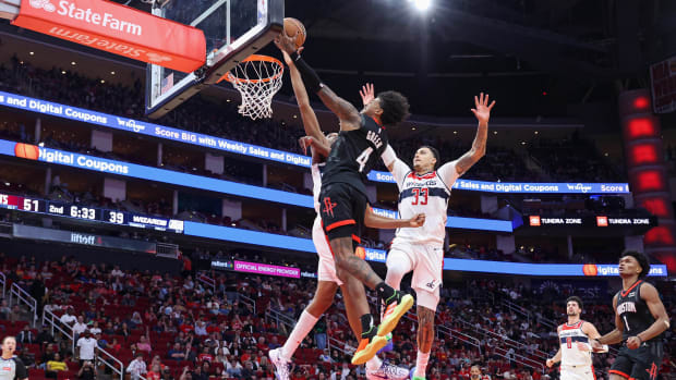 Rockets guard Jalen Green (4) shoots the ball as Washington Wizards guard Bilal Coulibaly (0) defends during the second quarter at Toyota Center.