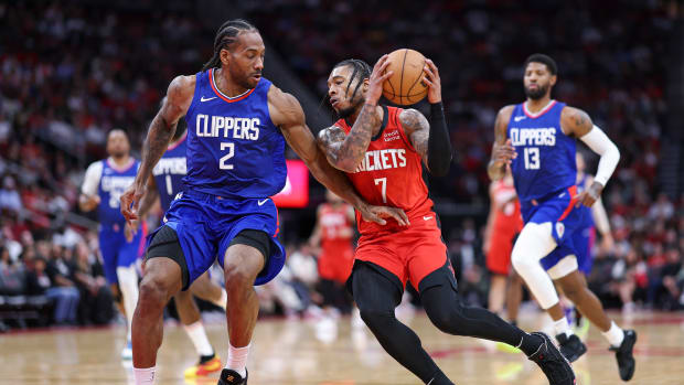 Rockets forward Cam Whitmore (7) drives with the ball as Los Angeles Clippers forward Kawhi Leonard (2) defends during the second quarter at Toyota Center